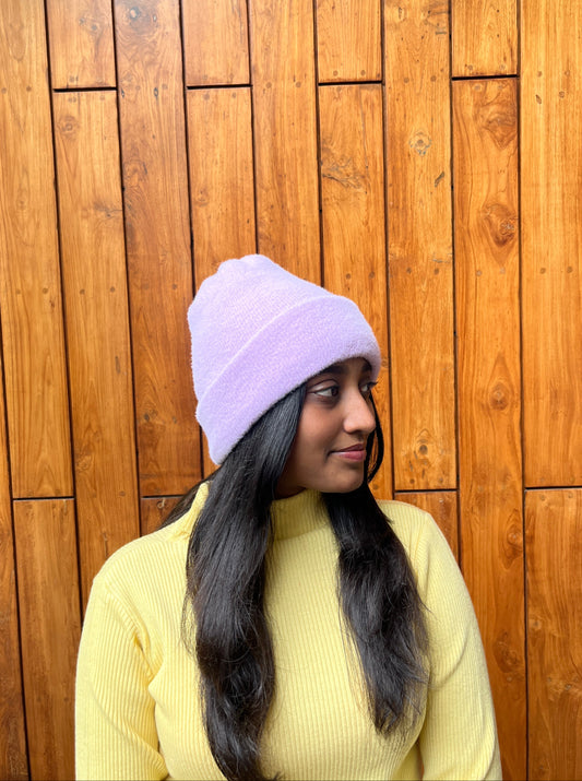 Woman wearing ivory knit cap with pearls and pom-pom – Madhuri Woollens