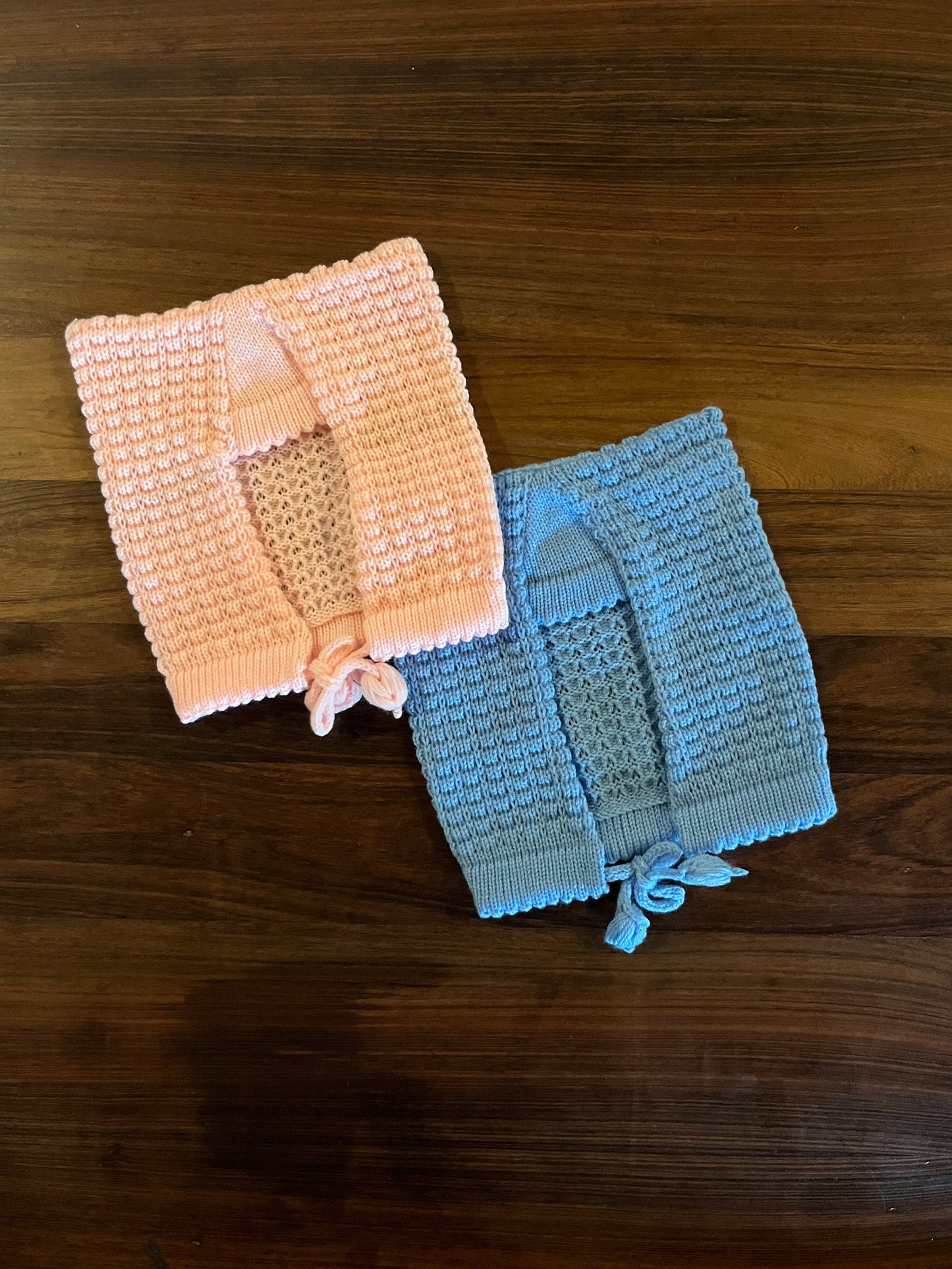 Hand-knitted wool baby sasa caps in baby pink and blue