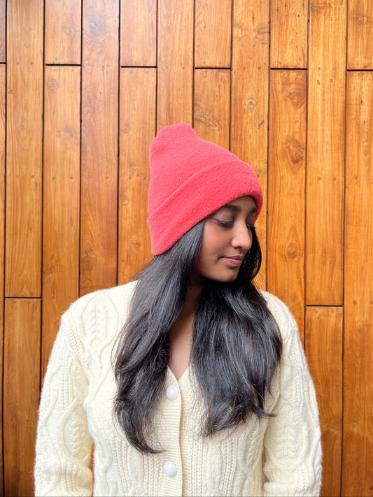 Woman wearing a blush pink fleece beanie winter cap – Madhuri Woollens