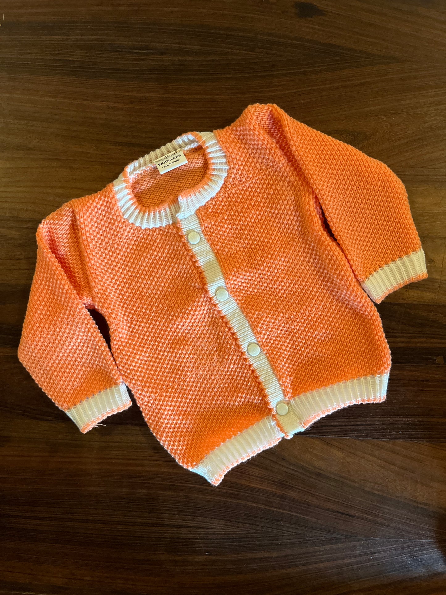 Peach 3-piece hand-knitted baby wool set – sweater, booties, and bonnet by Madhuri Woollens