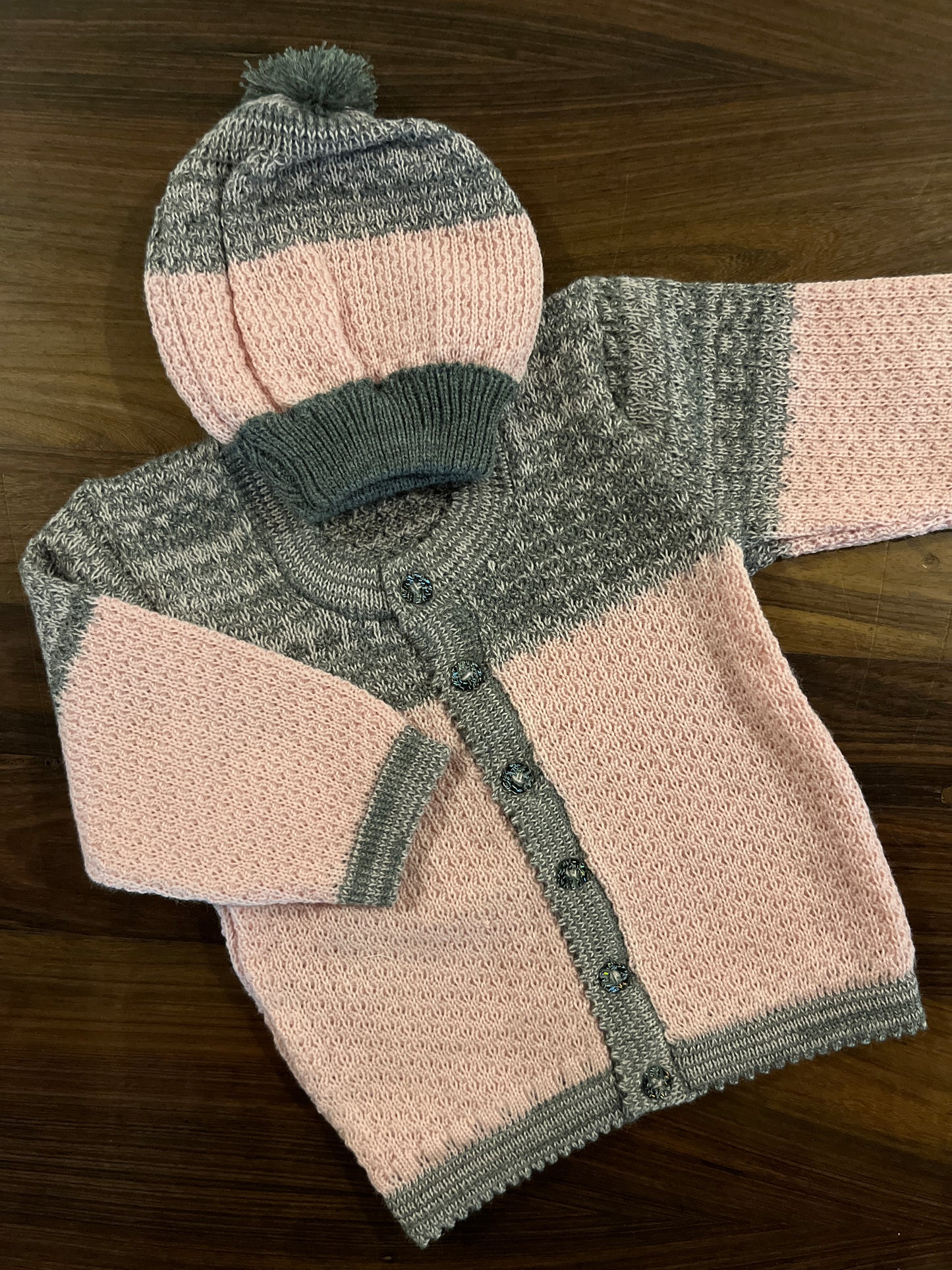 Pink and grey baby wool cardigan with matching pom-pom cap – Madhuri Woollens