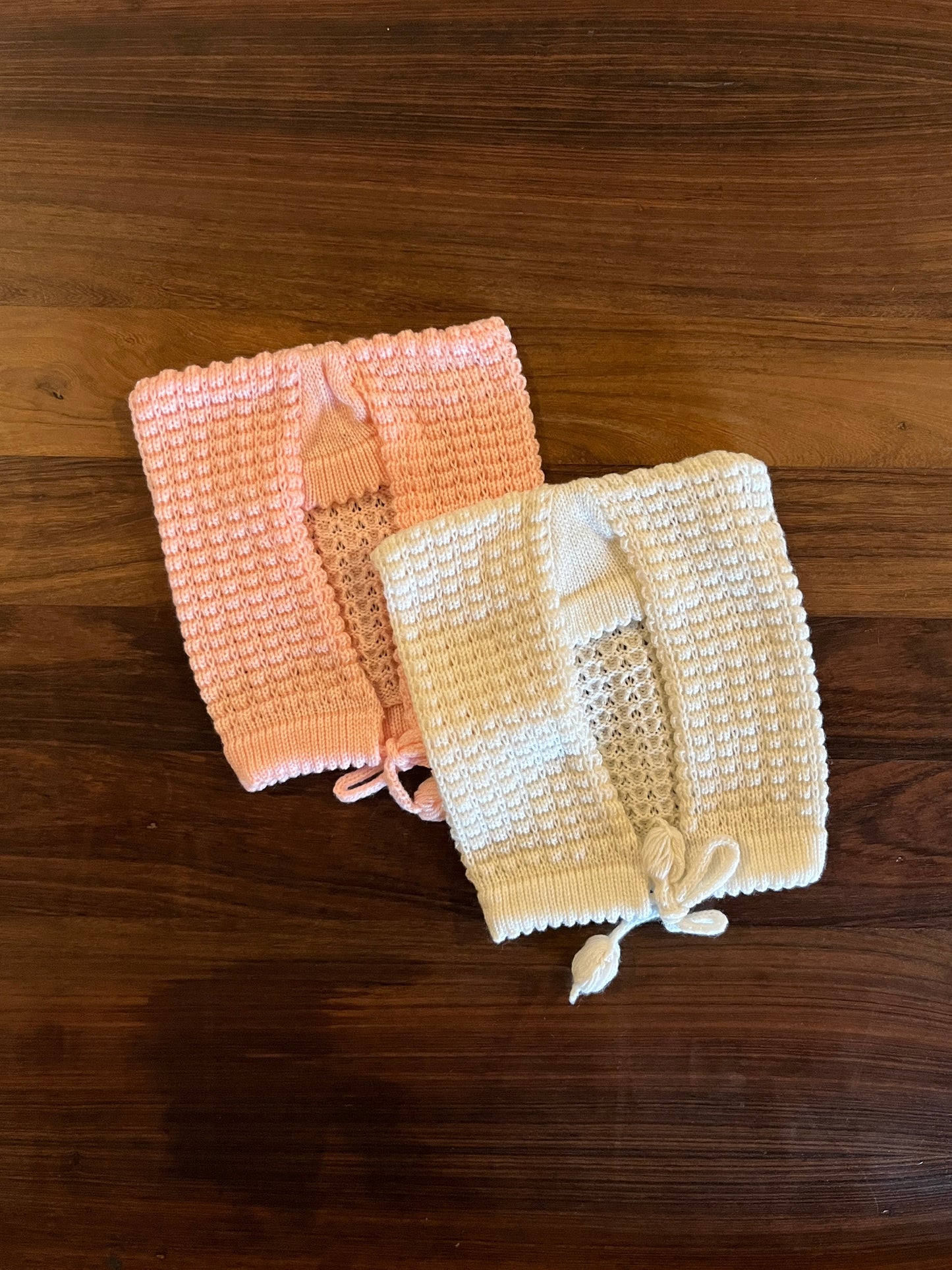 Hand-knitted wool baby sasa caps in baby pink and white