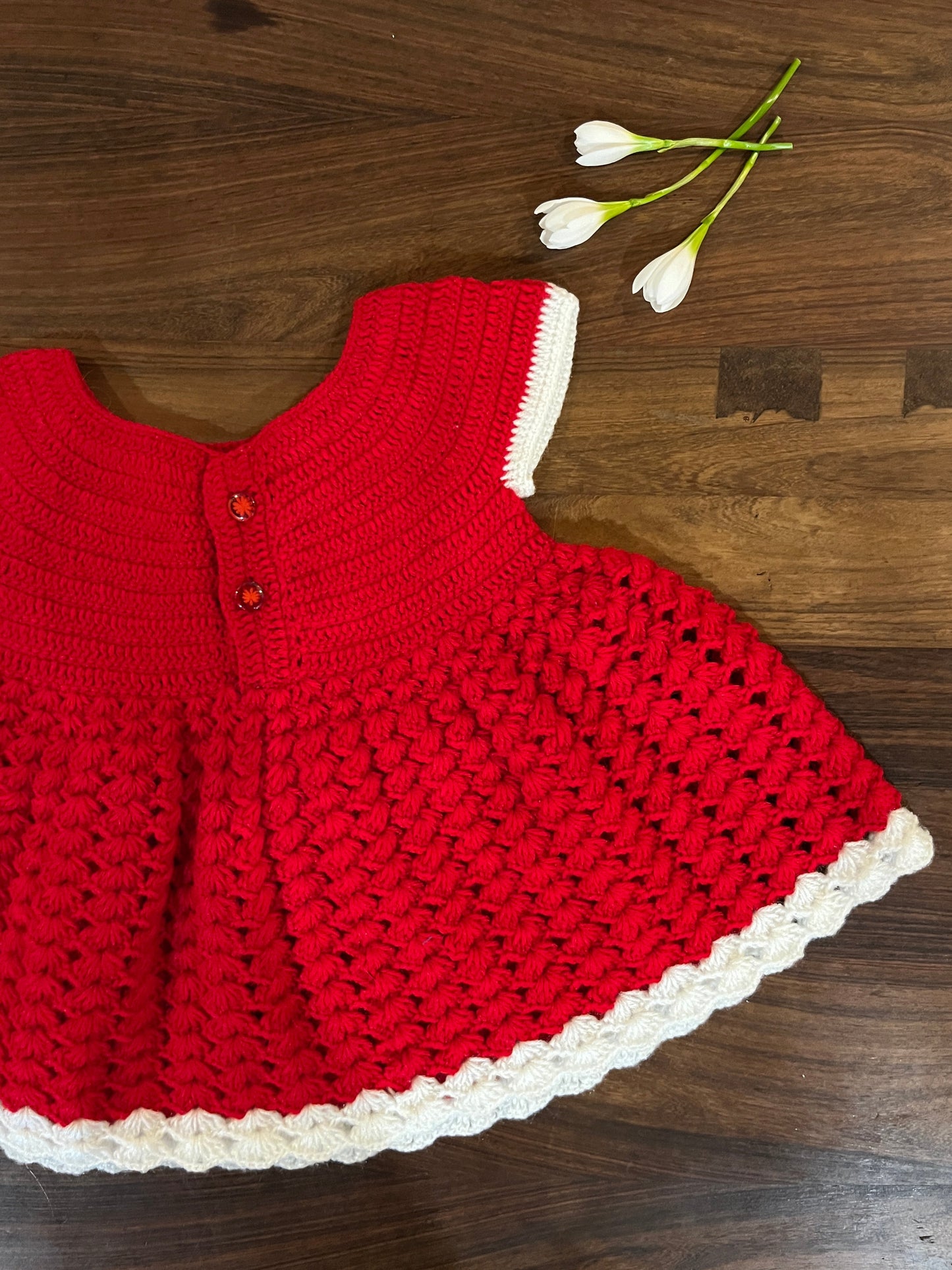 red and white handmade crochet baby dress for 6–12 months