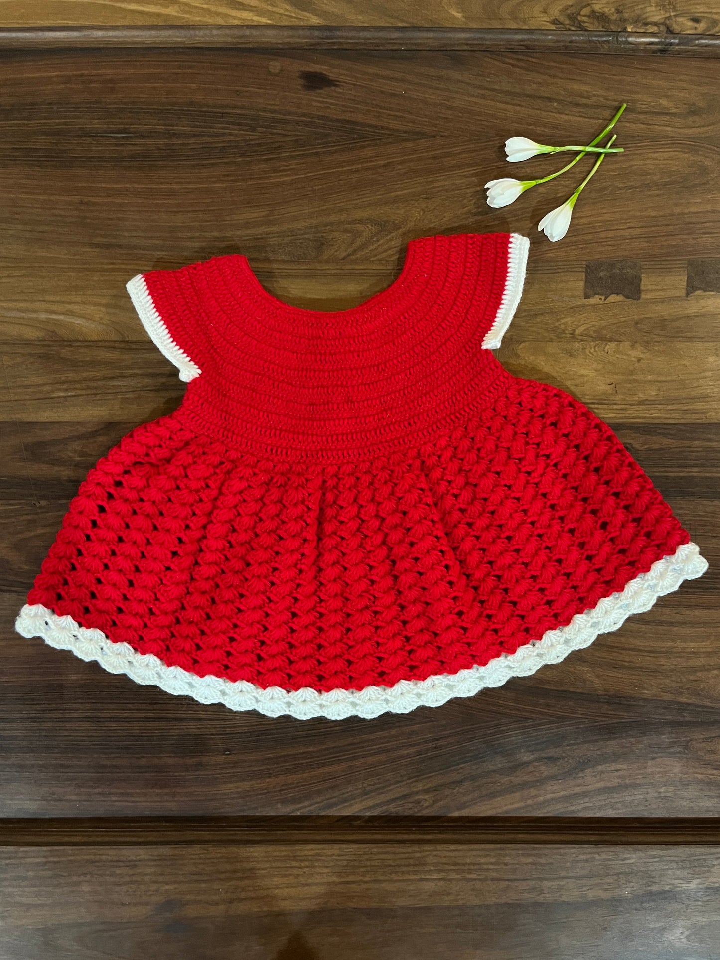 red and white handmade crochet baby dress for 6–12 months