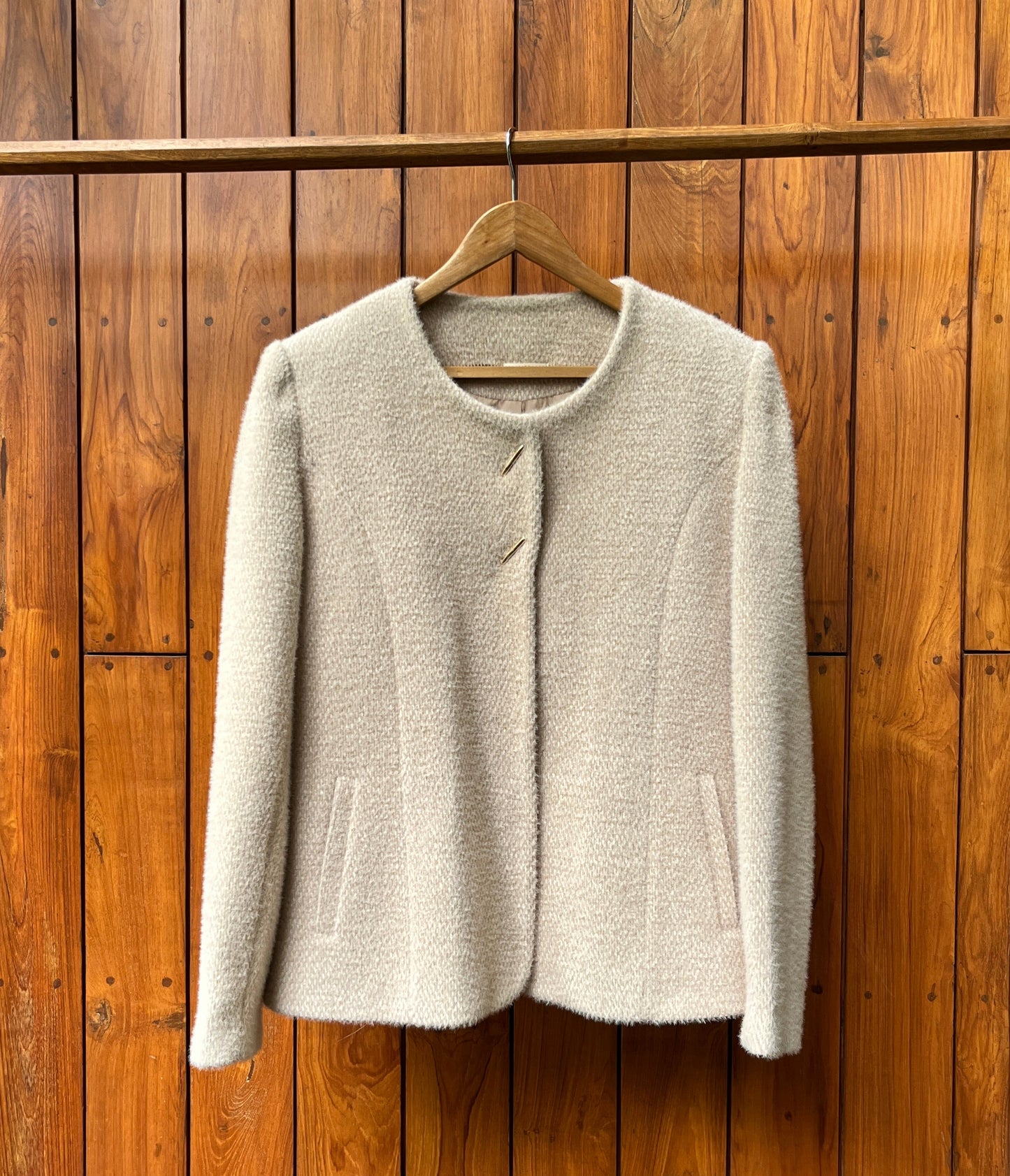 Ivory wool coat with gold buttons and clean tailoring for women