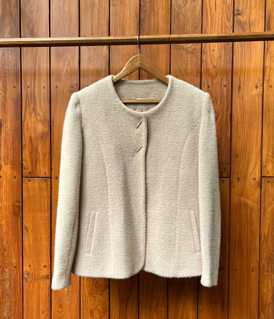 Ivory wool coat with gold buttons and clean tailoring for women