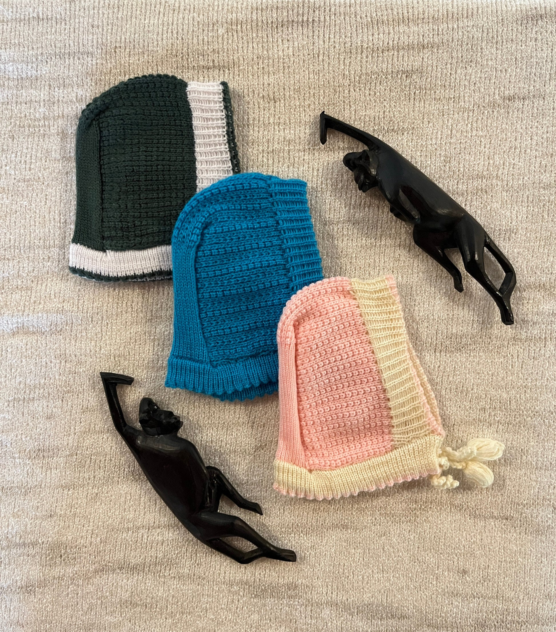 Wool baby bonnets in green, blue, and pink – classic winter caps for newborns and infants – Madhuri Woollens.