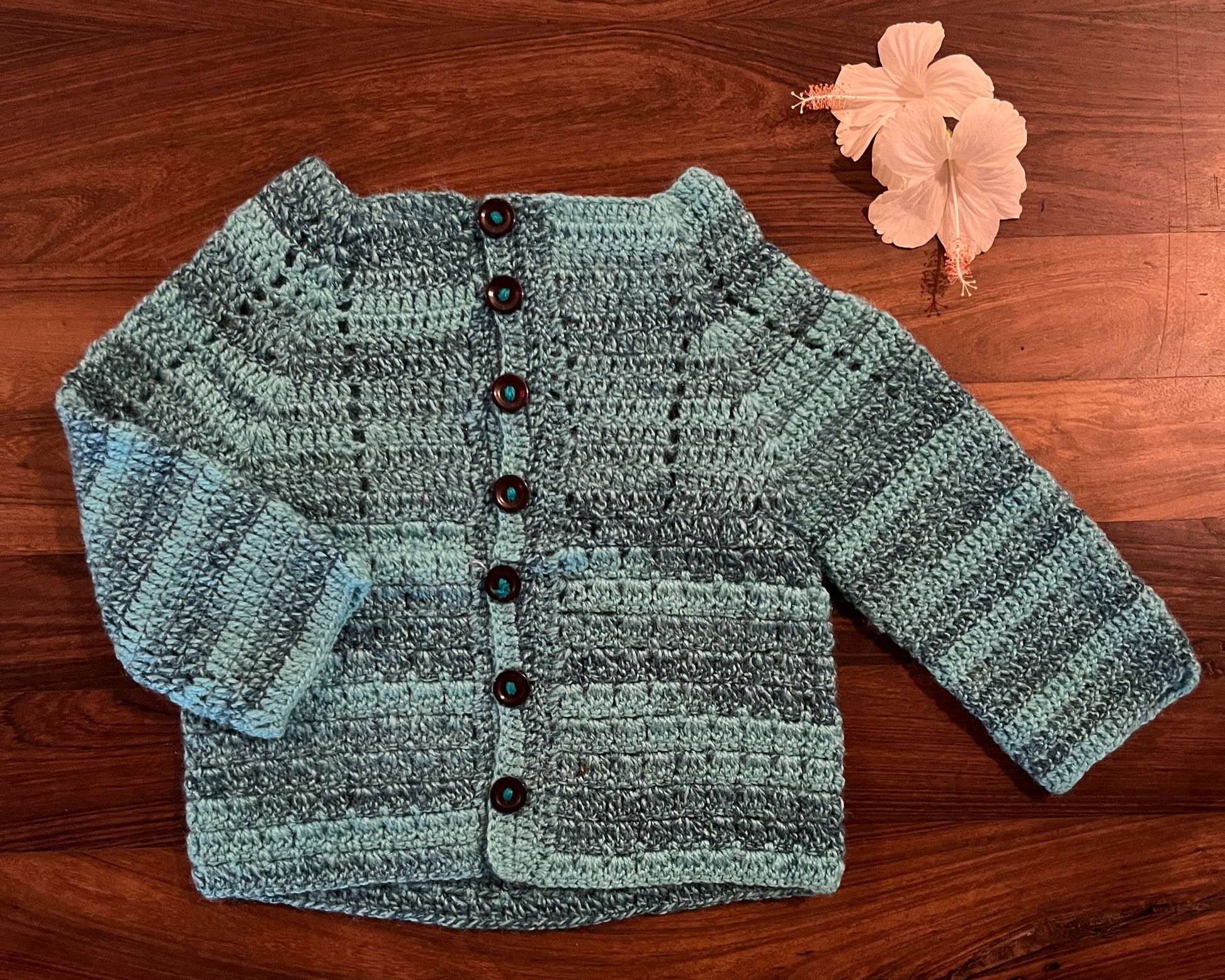 Sky blue crochet woollen cardigan for baby – handcrafted winter wear