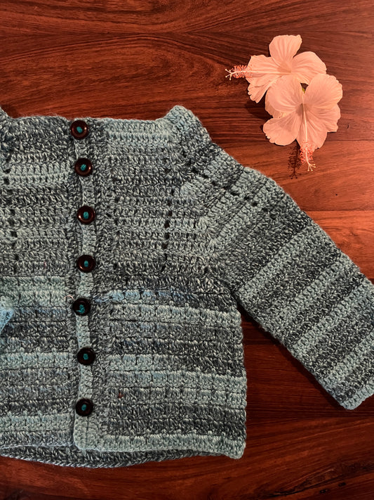 Sky blue crochet woollen cardigan for baby – handcrafted winter wear


