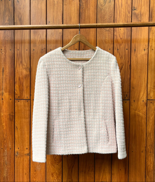Light pink tweed ladies coat with round neckline and textured finish