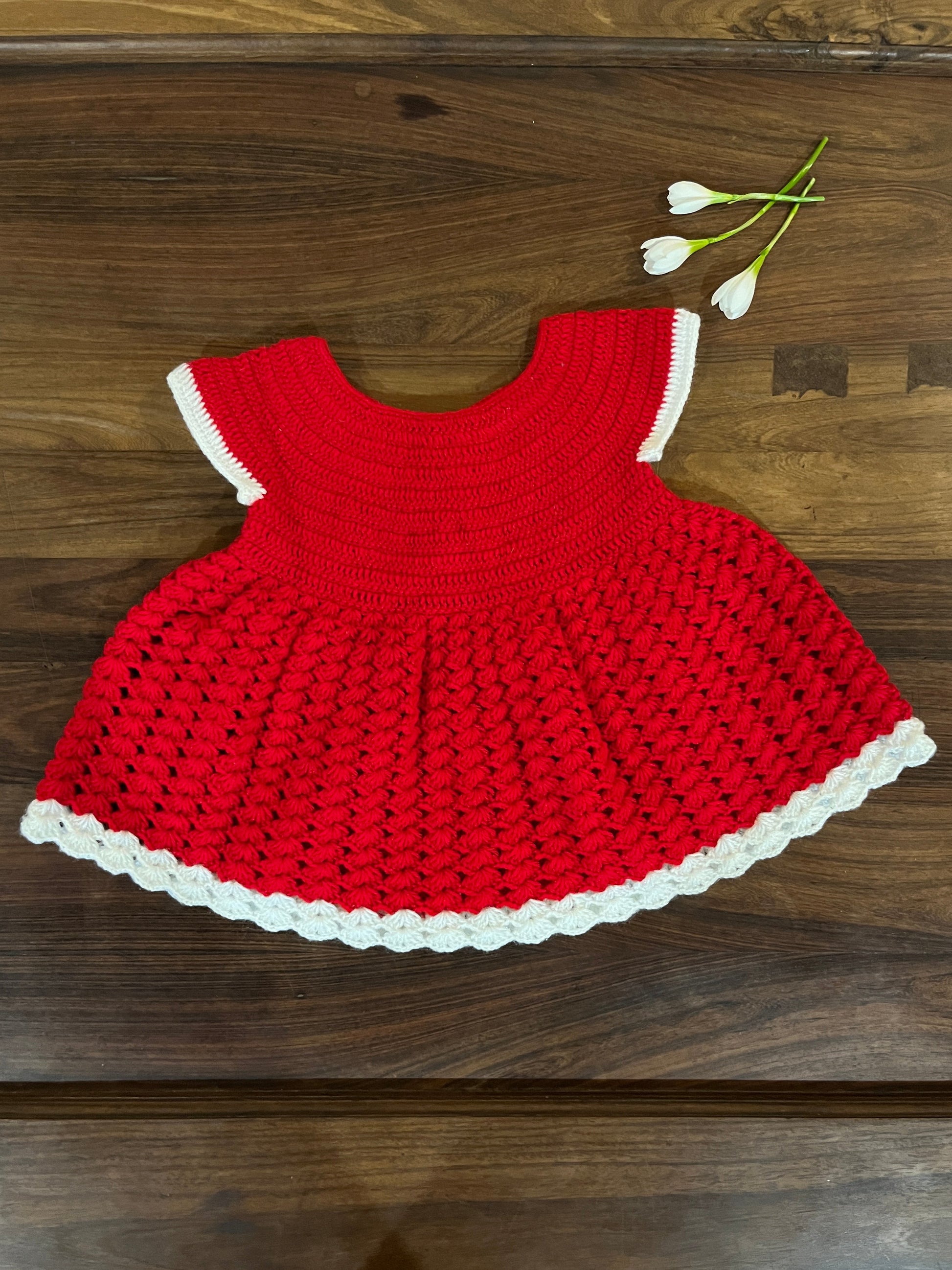 red and white handmade crochet baby dress for 6–12 months